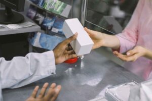 person handing over box