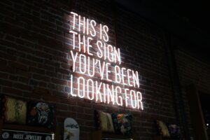 neon sign that says "this is the sign you've been looking for"